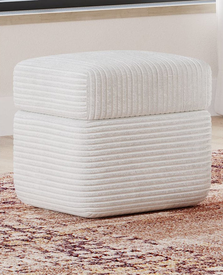 Wisteria Upholstered Storage Ottoman in Frosty Corduroy — styled in a room
