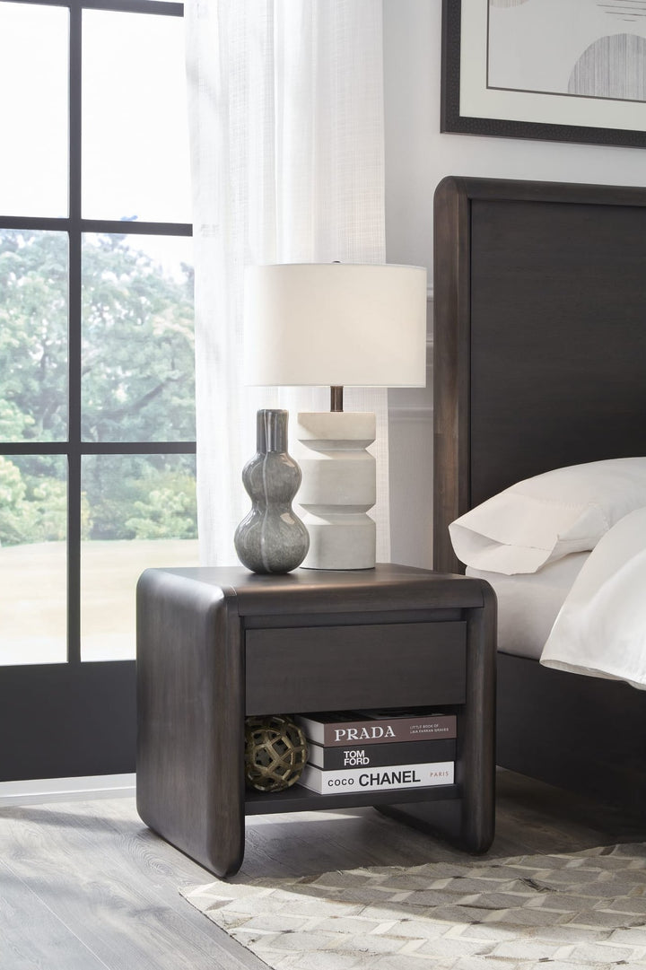 Xolani One Drawer Nightstand in Jaguar — in a bedroom setting