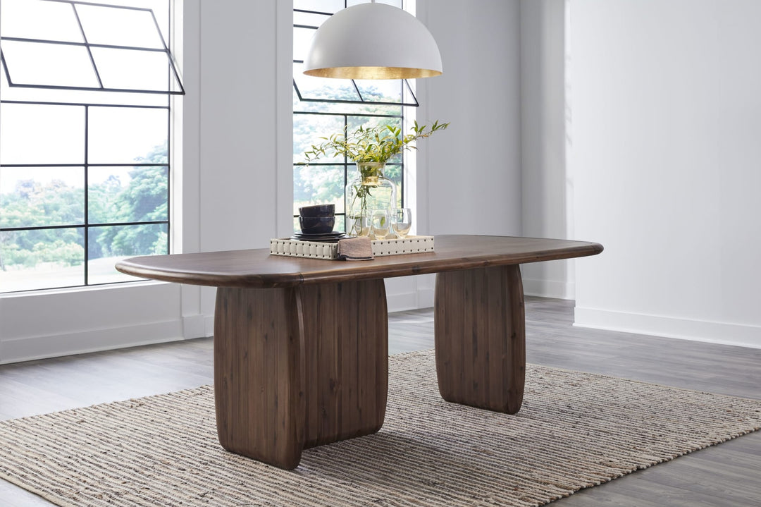 Xolani Pedestal Dining Table in Impala — lifestyle photo