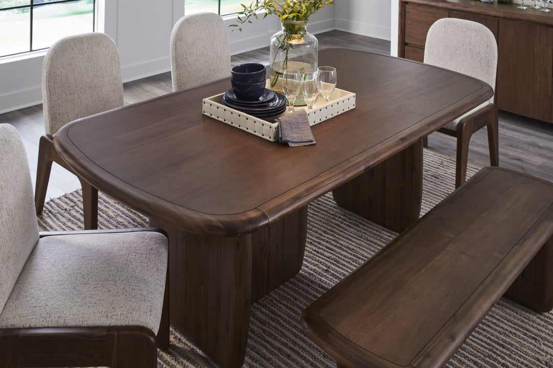 Xolani Pedestal Dining Table in Impala — lifestyle photo