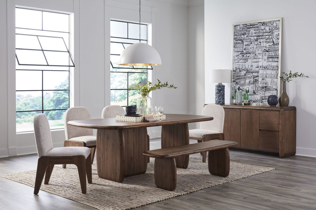 Xolani Pedestal Dining Table in Impala — lifestyle photo