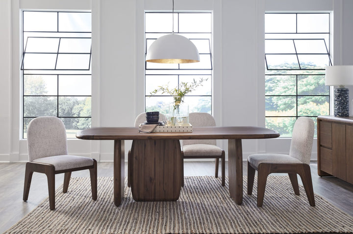 Xolani Pedestal Dining Table in Impala — lifestyle photo