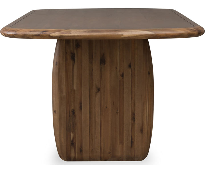 Xolani Pedestal Dining Table in Impala — product view on a white background