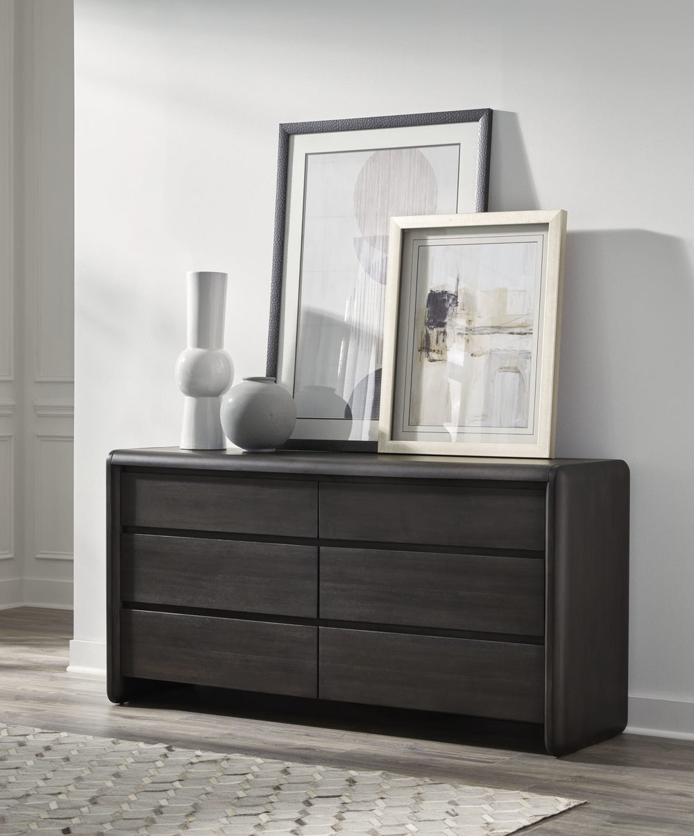 Xolani Six Drawer Dresser in Jaguar — styled in a room