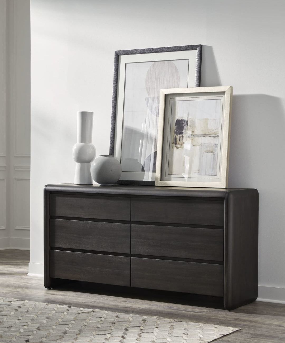 Xolani Six Drawer Dresser in Jaguar — styled in a room