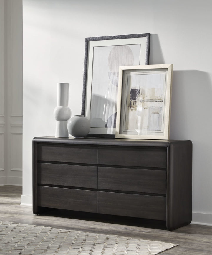 Xolani Six Drawer Dresser in Jaguar — styled in a room