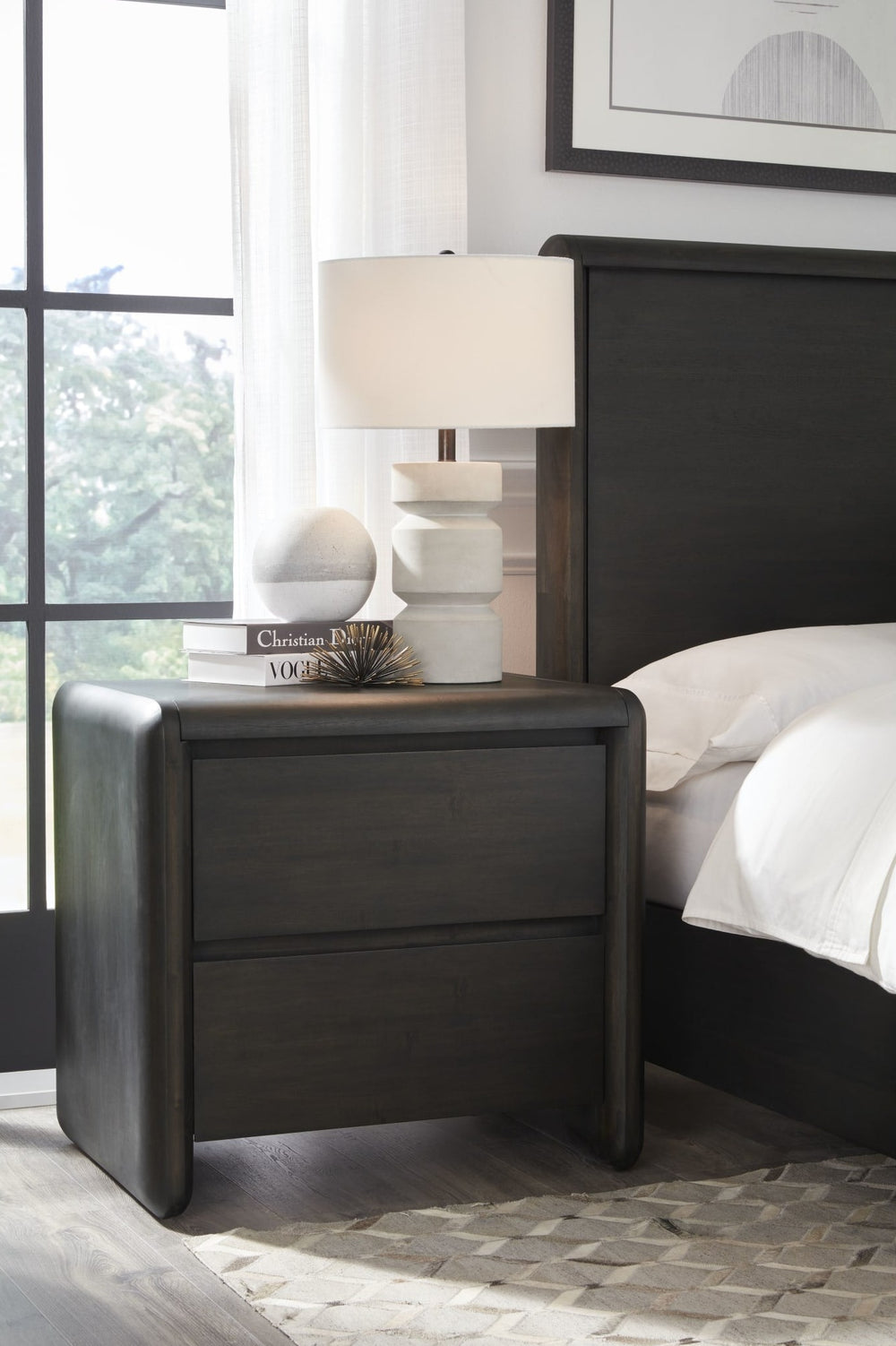 Xolani Two Drawer Nightstand in Jaguar — in a bedroom setting