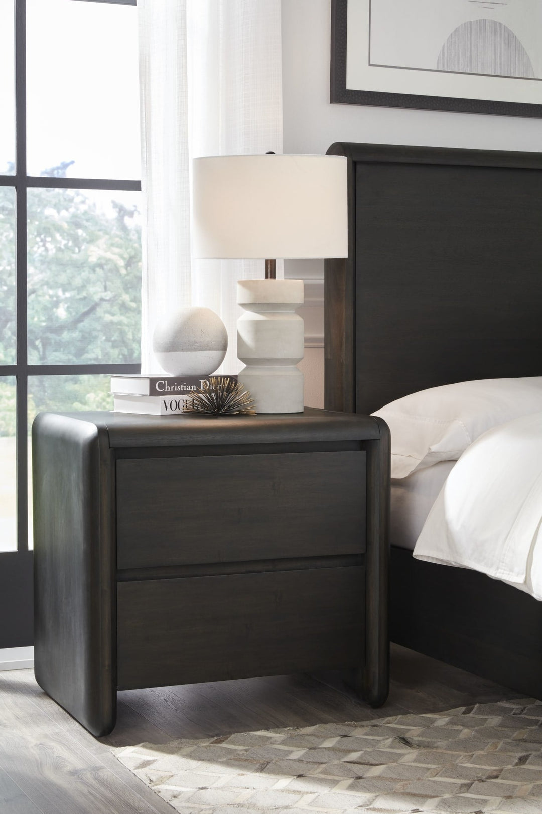 Xolani Two Drawer Nightstand in Jaguar — in a bedroom setting