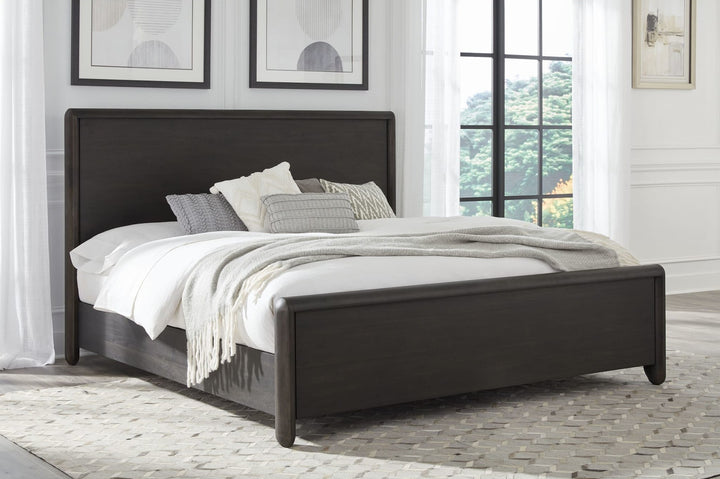 Xolani Wood Platform Bed in Jaguar styled in a bedroom