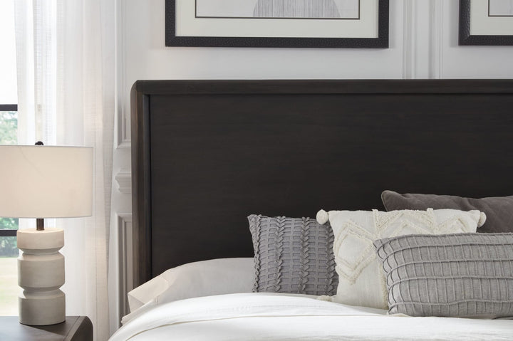 Xolani Wood Platform Bed in Jaguar styled in a bedroom