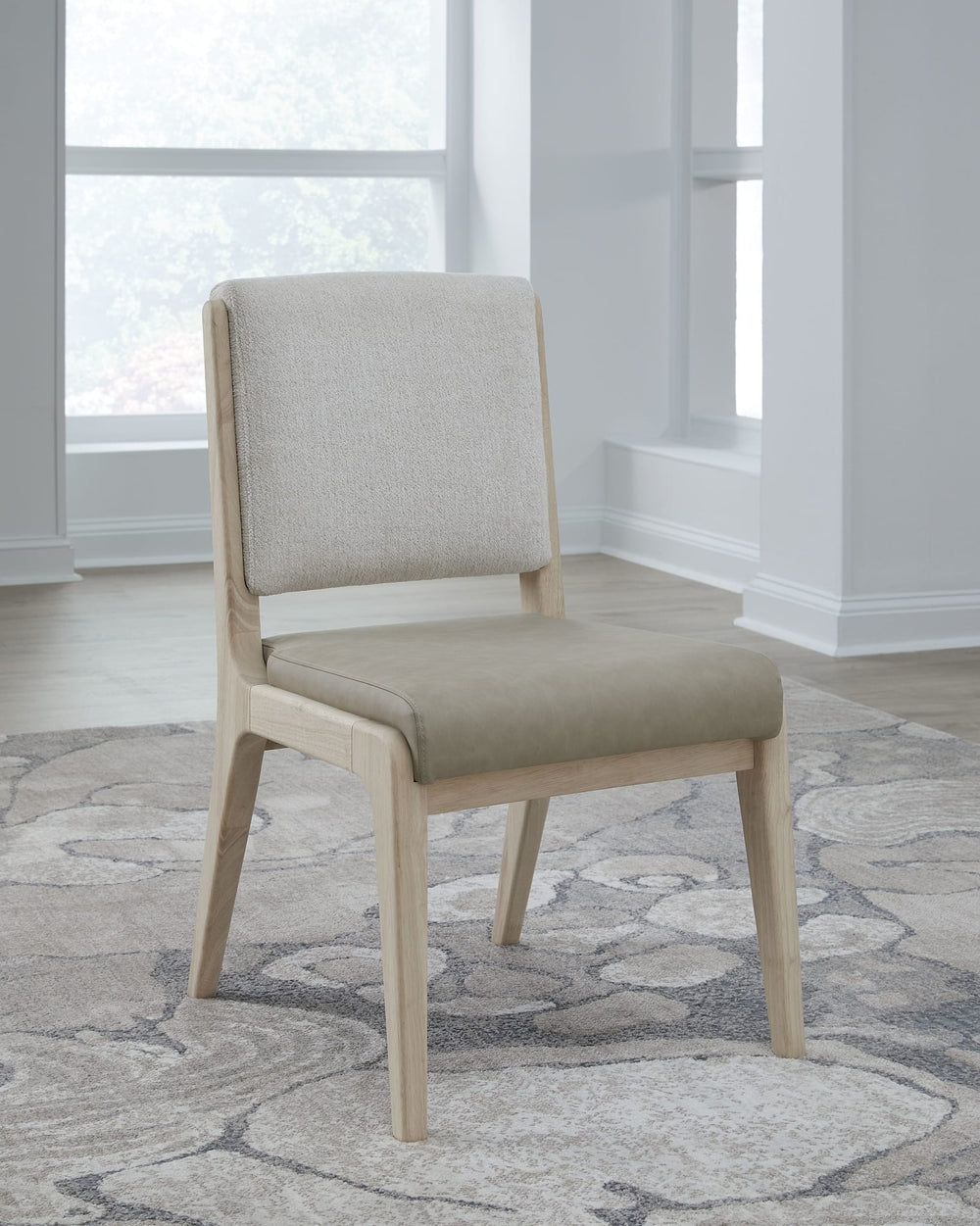 Zinnia Upholstered Dining Chair in White Sand, Buttermilk Leather and Dune Chenille — lifestyle photo