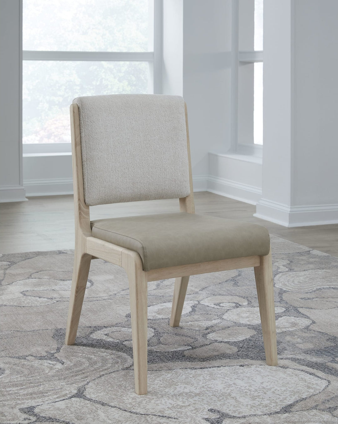 Zinnia Upholstered Dining Chair in White Sand, Buttermilk Leather and Dune Chenille — lifestyle photo