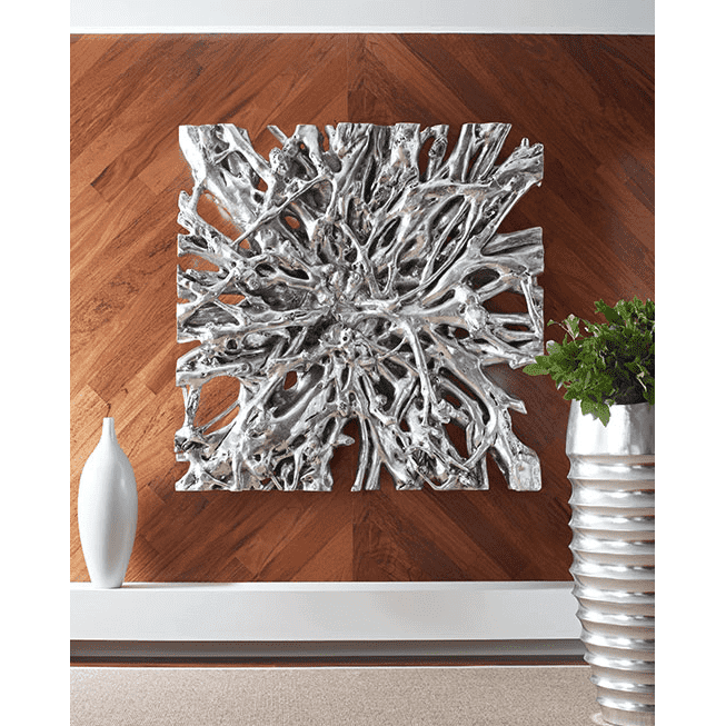 Sculptural silver wall art in a contemporary interior