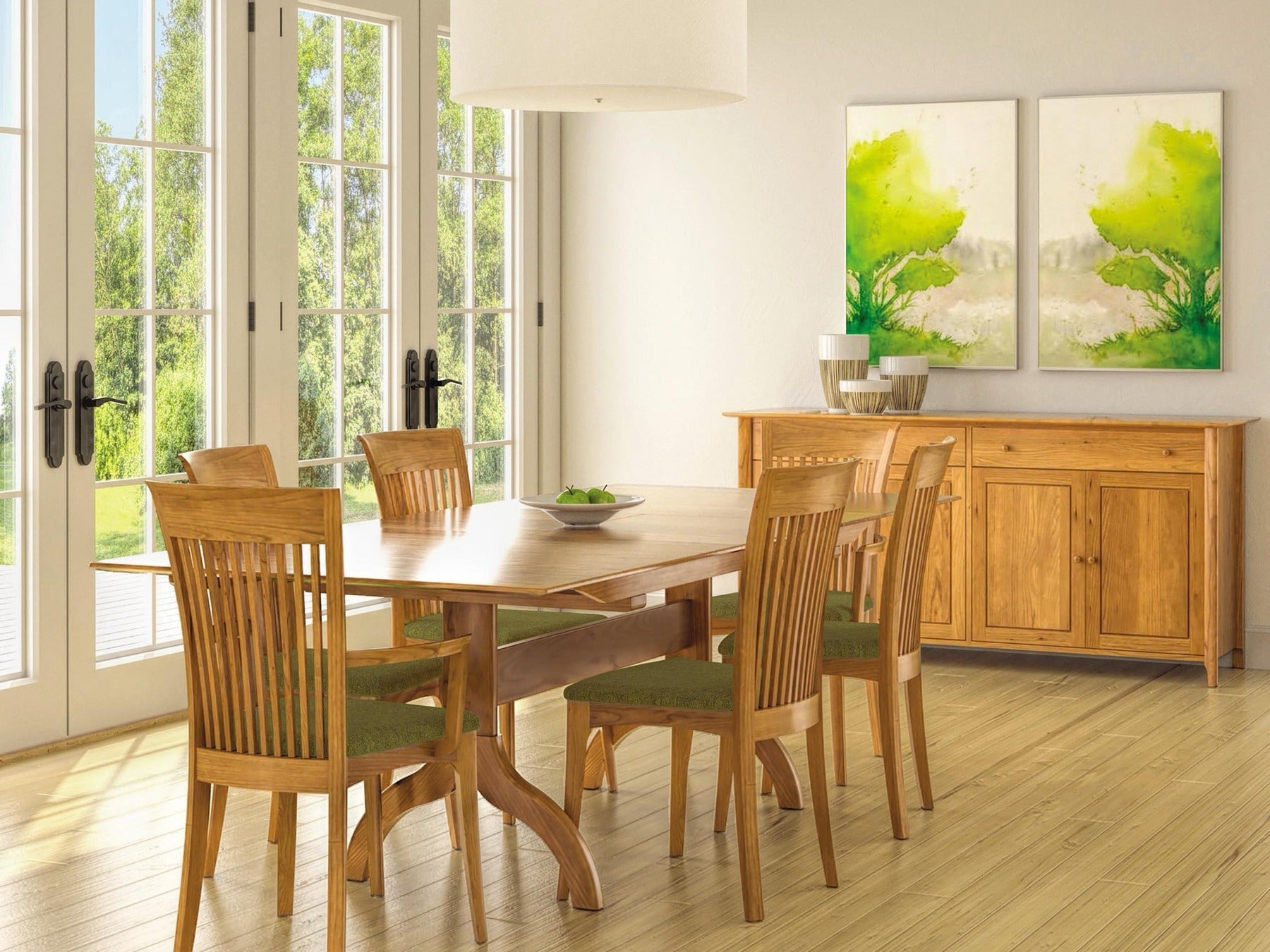 Copeland Sarah trestle dining table with Shaker chairs and buffet in a bright dining room