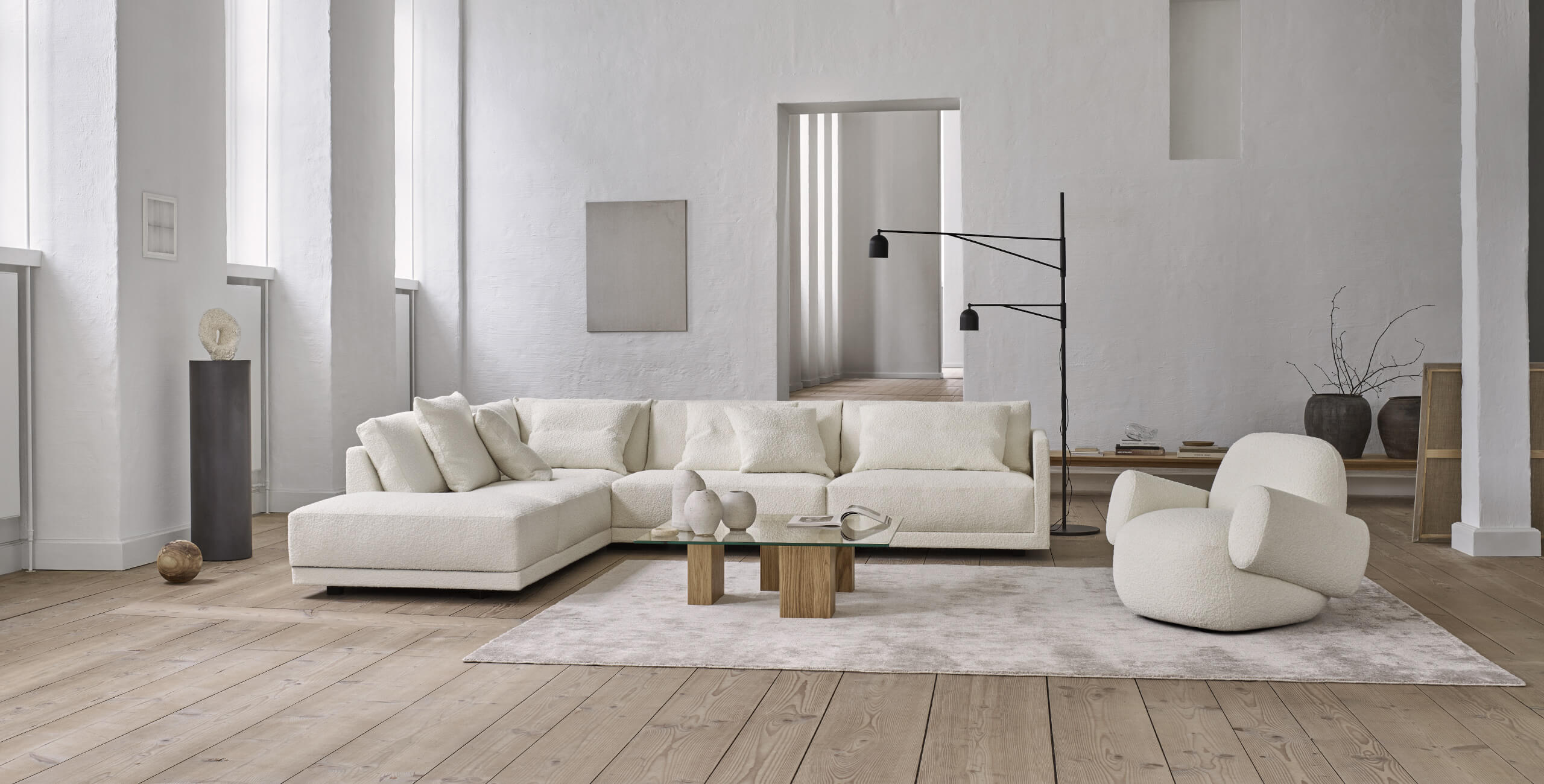 Drop corner sofa with Havana chair in an ambient room