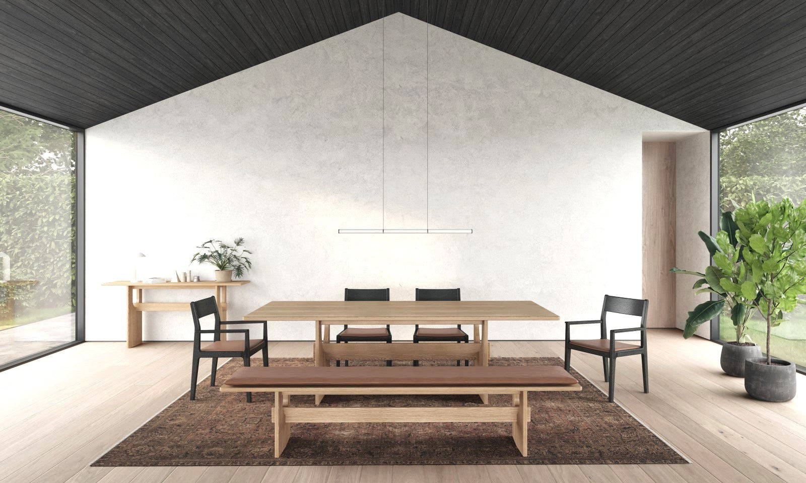 Huppé Kobe dining table and bench in a vaulted dining room