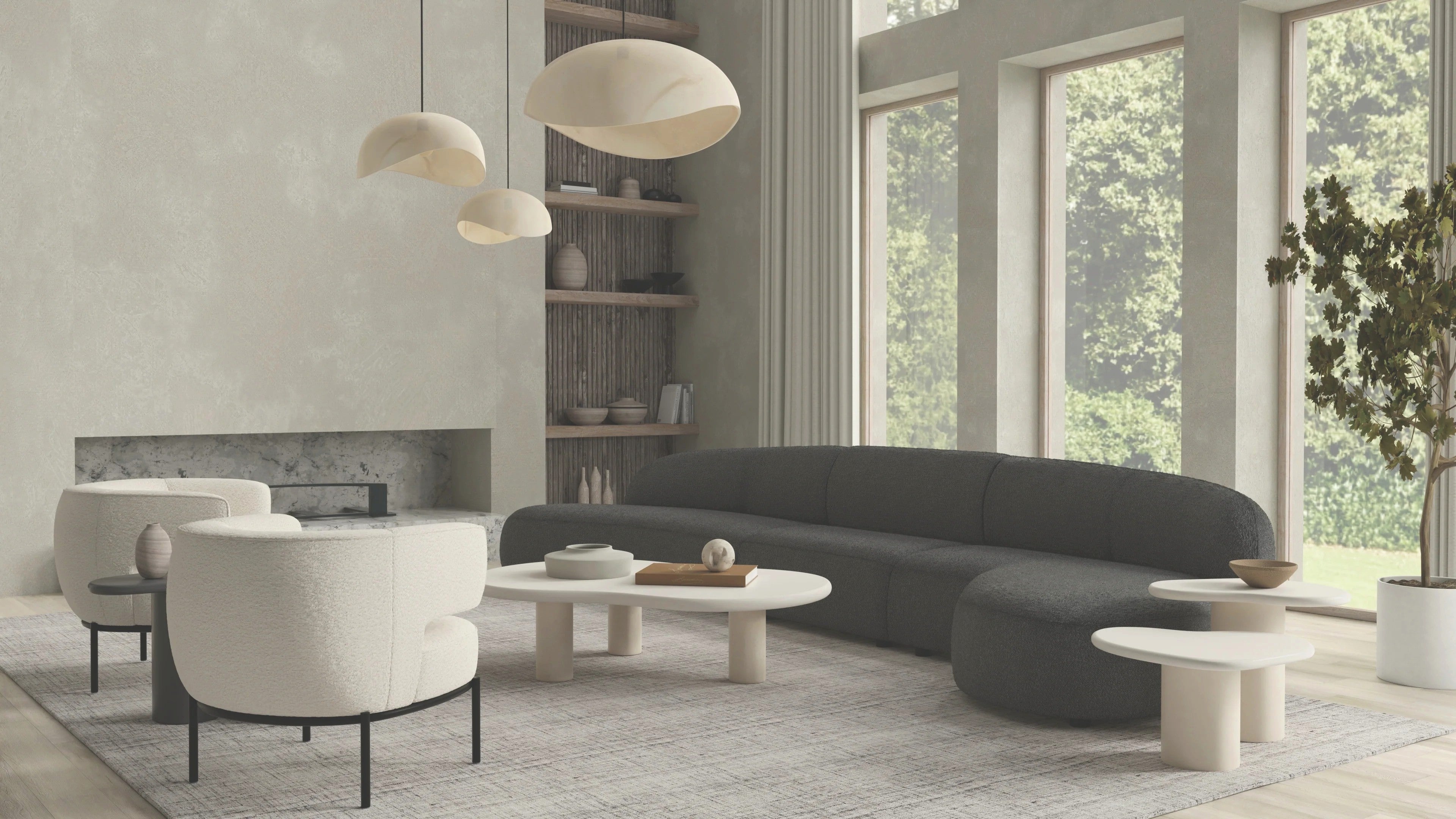 Organic modern living room with dark curved Mobital sectional and cream barrel chairs