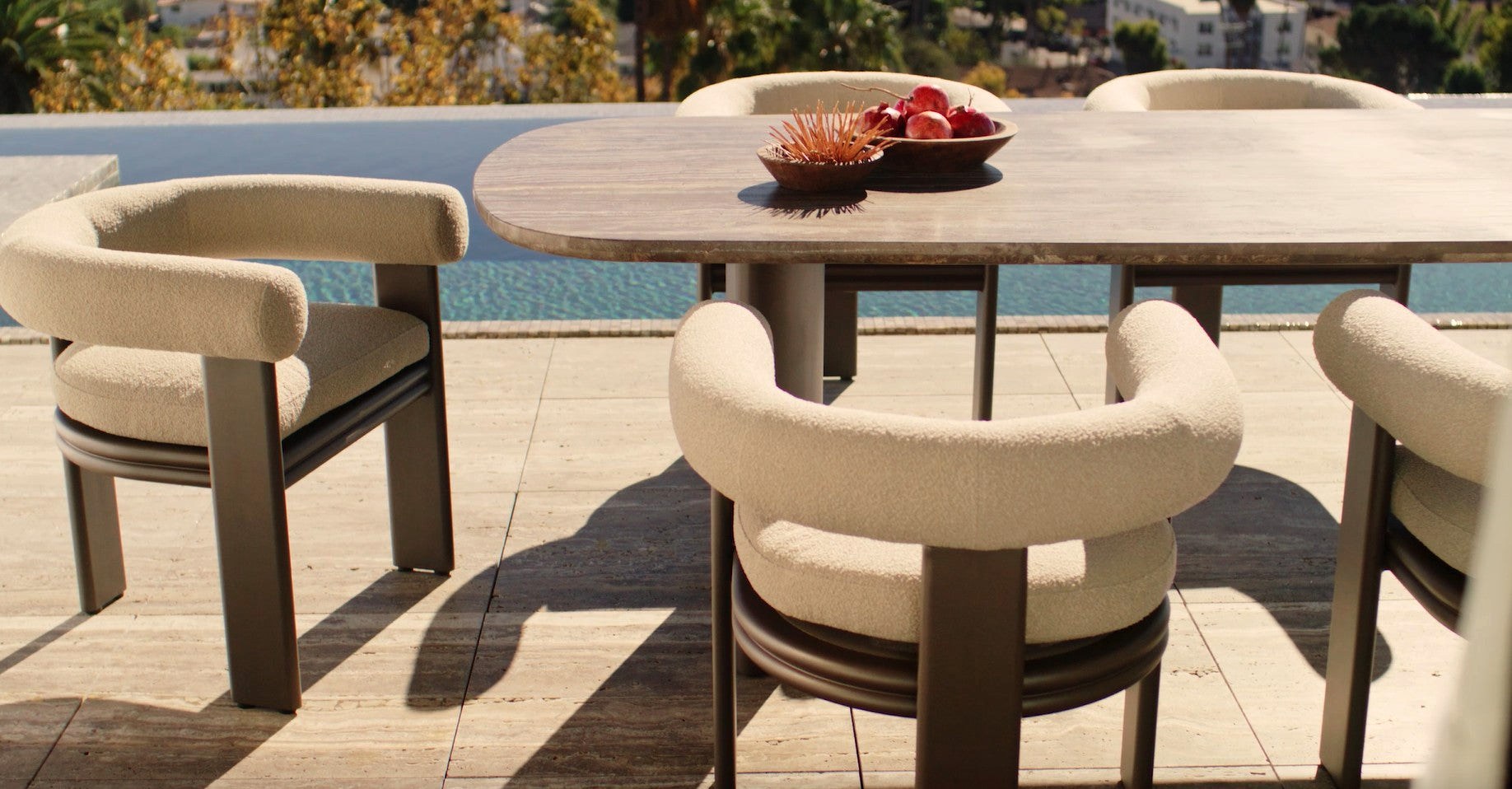 Collins aluminum dining set on a sunlit pool terrace