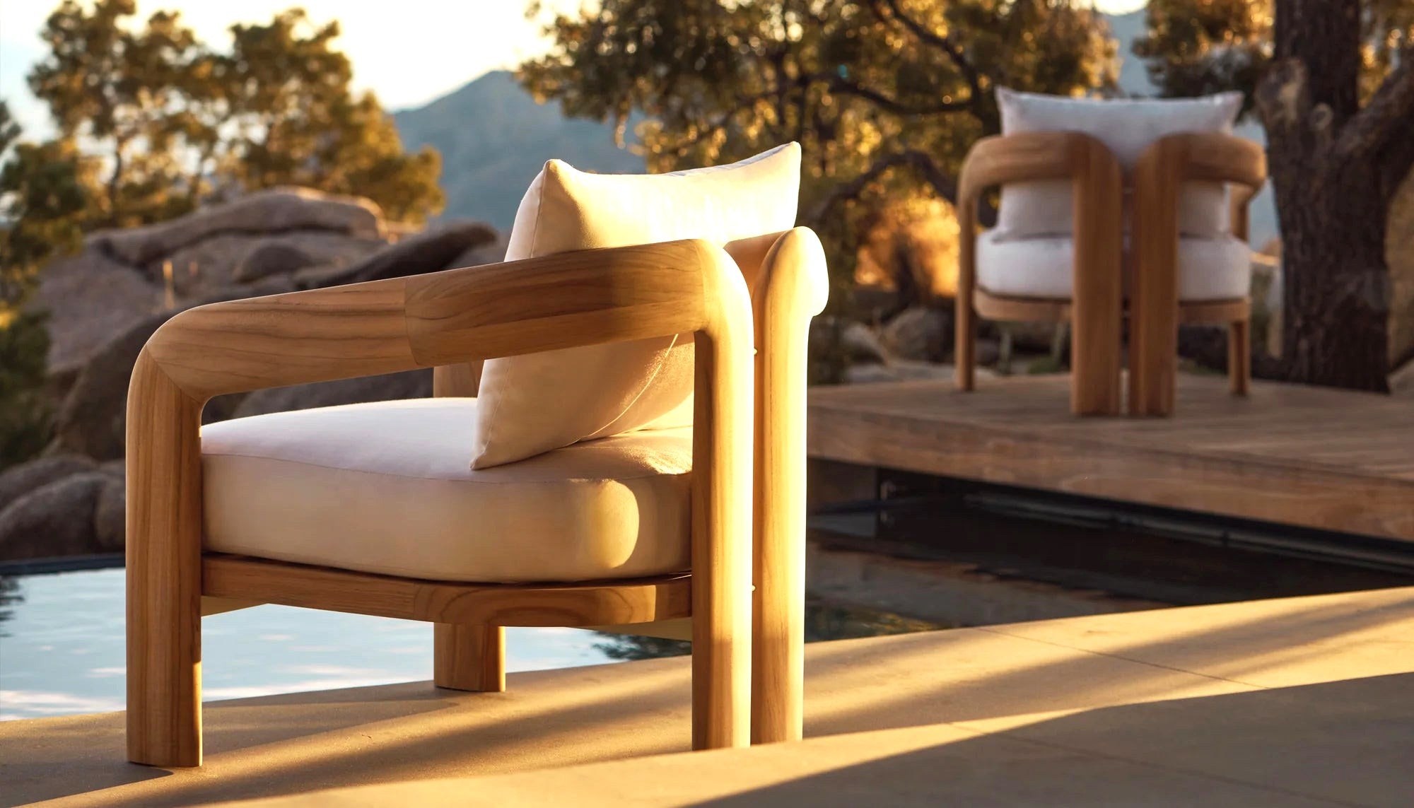 Chloe teak lounge chairs on a coastal sundown terrace