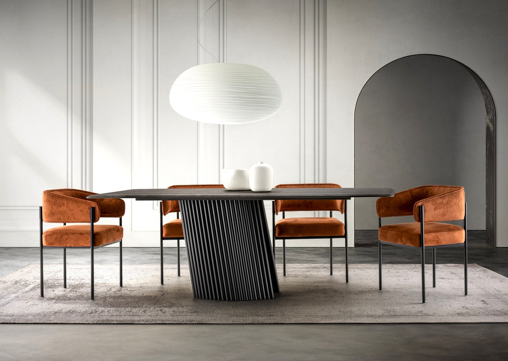 Trica Pisa dining table with orange velvet chairs in a modern dining room
